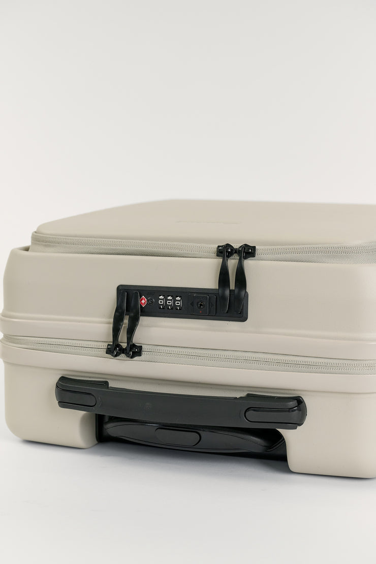AIRE (Beige) Recycled Carry On Suitcase